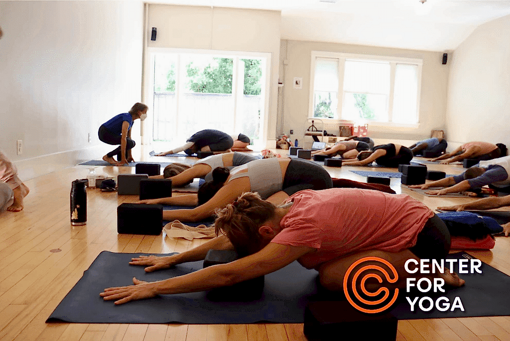 class doing restorative yoga