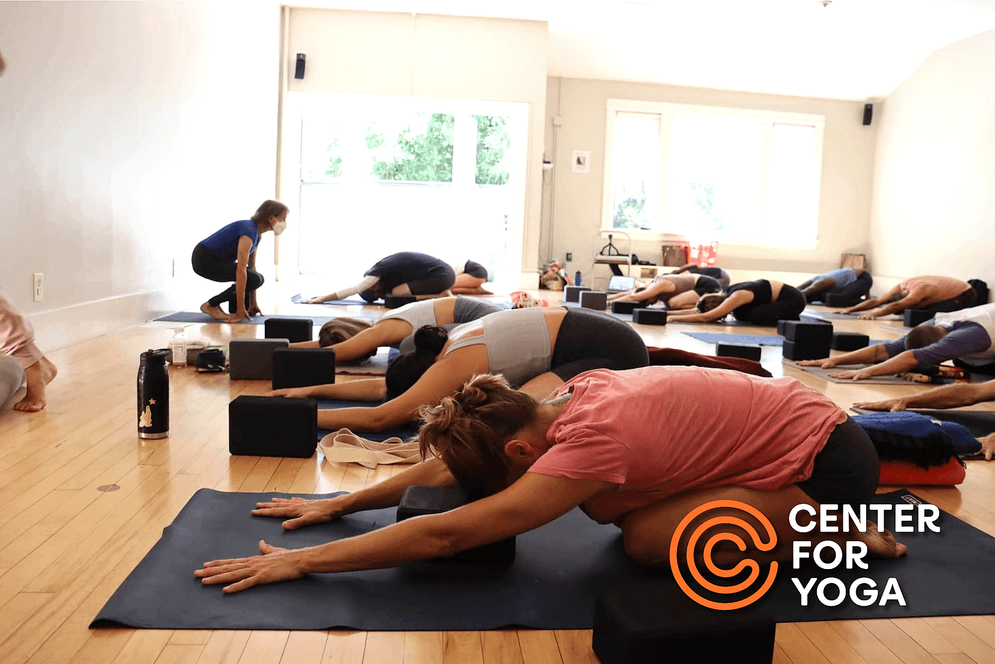 class doing restorative yoga
