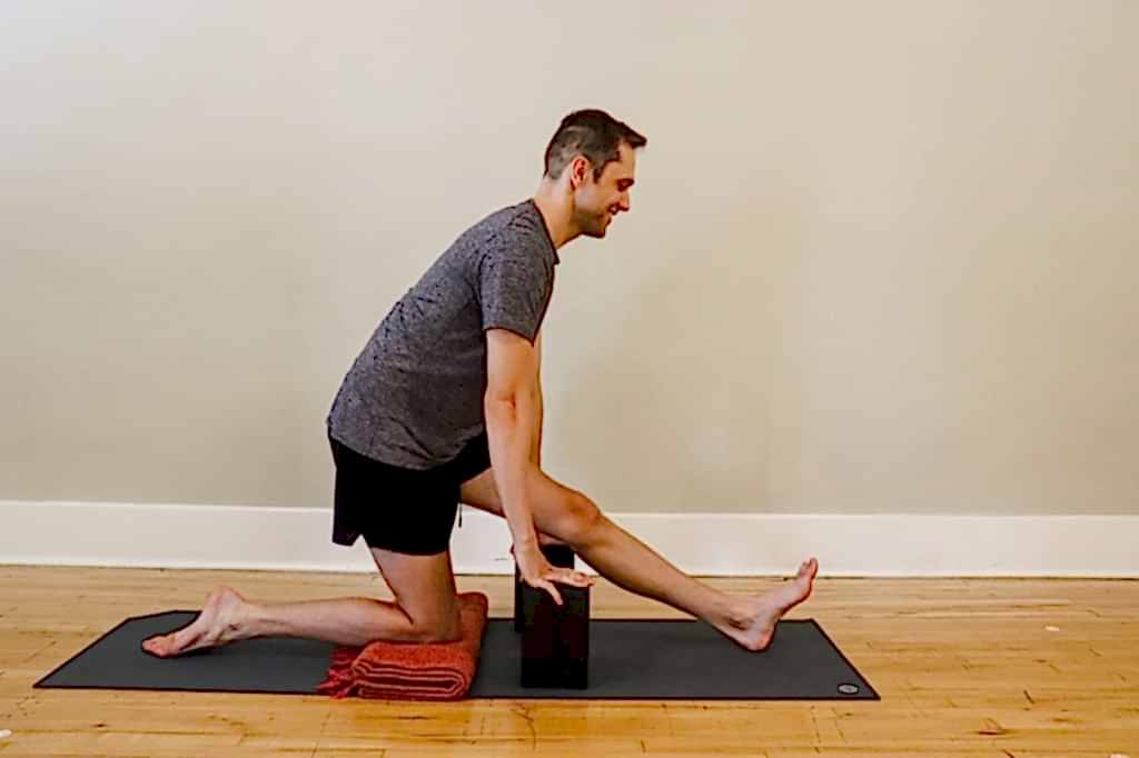 practitioner using yoga blocks